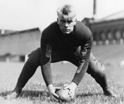 Which president was offered a professional football contract by the Detroit Lions and Green Bay Packers after college?